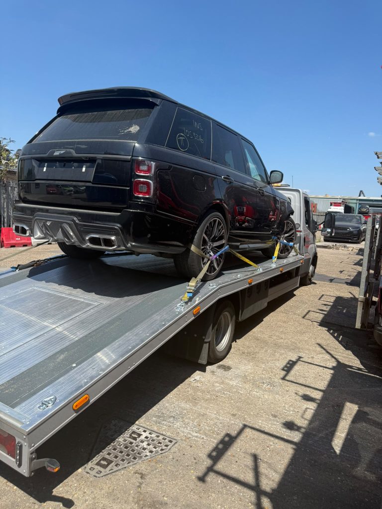 What Is Roadside Assistance Cover? – Accident Recovery by J13 Rescue Accident-damaged Range Rover being recovered by J13 Rescue on a professional recovery truck in Berkshire.